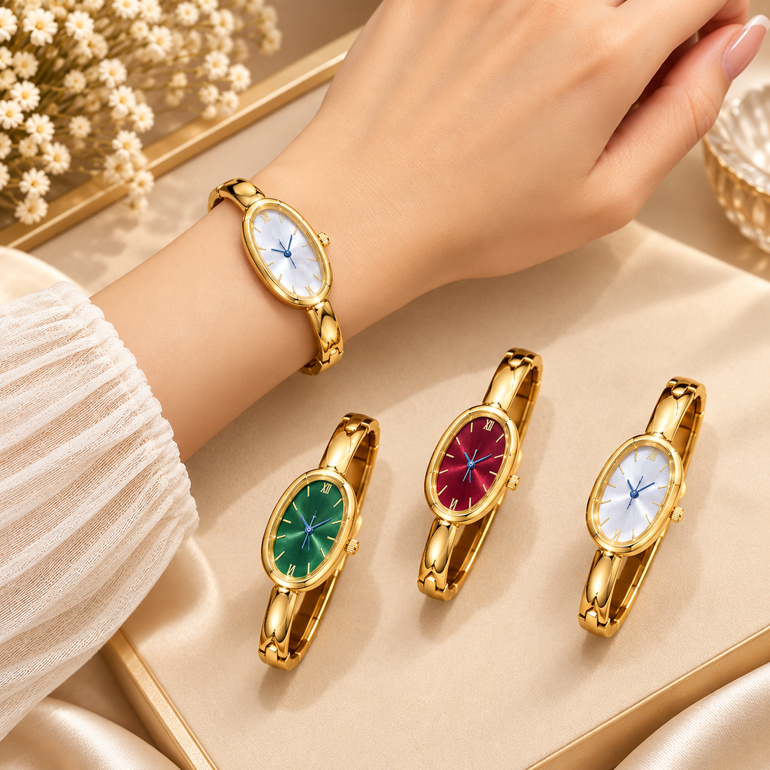 Gold-tone 304 stainless steel bangle watch with an oval dial in white, green and red, worn on a wrist and shown with two more colour options