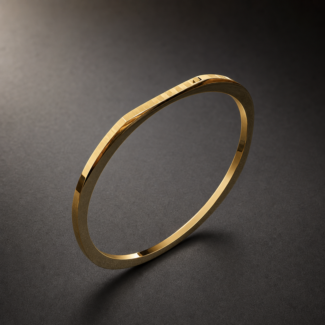 A single rigid square-profile kada in yellow gold colour with a polished mirror finish. The band is about 1/25 of the outer diameter in width and slightly thinner in depth, with a flat square cross-section whose width stays even the whole way round. The closure appears to be a fully closed circle; no hinge, clasp or gap is visible, so there are no terminals. No stones, studs or applied motifs are present.