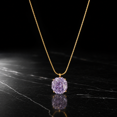 One single-strand pendant necklace in yellow-gold-coloured metal with a bright polished finish. The chain is a fine, tightly woven round chain (wheat/snake-like links of small, even gauge) with no branches; its total run is roughly 35-40 times the width of the pendant stone. No clasp, extender chain or terminal tag is visible; both ends of the chain run out of view, so closure type cannot be confirmed and no extender length can be stated.