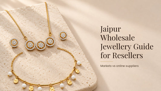 Jaipur Wholesale Jewellery Guide for Resellers. Brass Indian pendant set and a stainless steel necklace on a pale cream stone slab