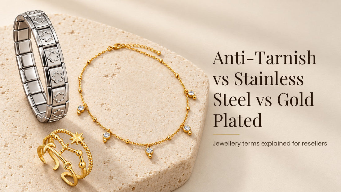 Anti-Tarnish vs Stainless Steel vs Gold Plated. Silver-tone steel bracelet, gold-tone necklace and ring on a pale cream stone slab