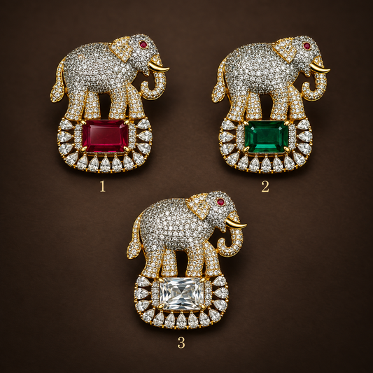 Two-tone brass elephant brooch set with pavé stones and a rectangular centre stone in red, green or clear, numbered 1 to 3