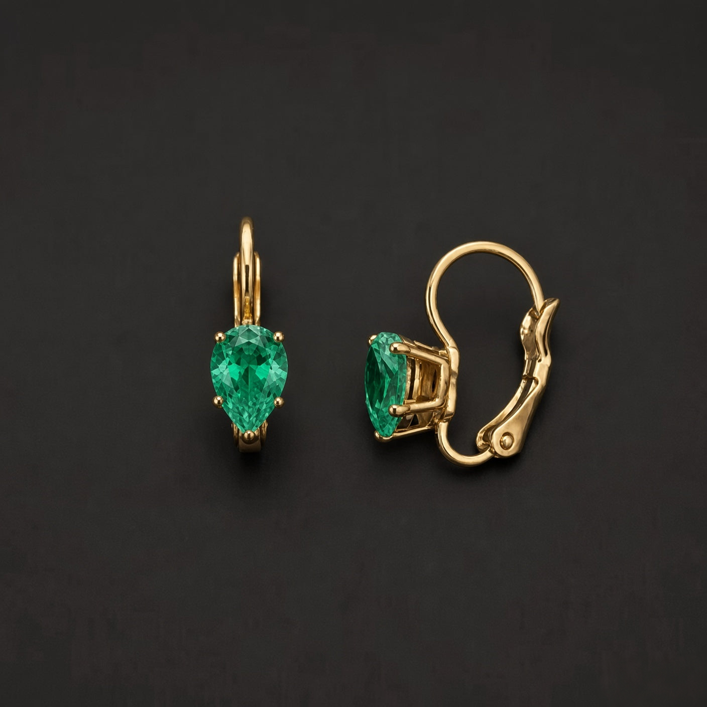 Gold-tone 304 stainless steel pair of drop earrings with pear-cut green stones in claw settings and French lever backs, shown as a pair