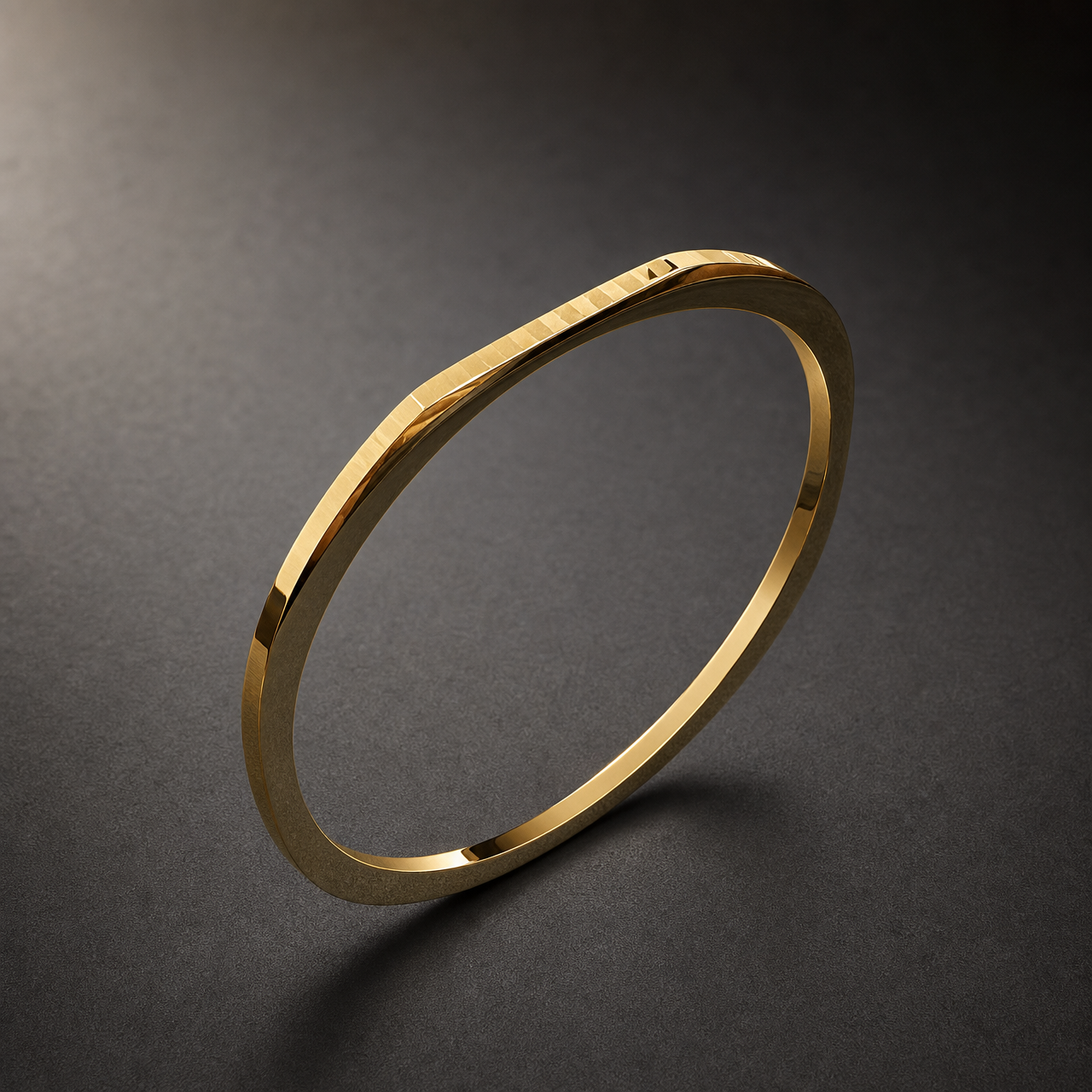 A single rigid square-profile kada in yellow gold colour with a polished mirror finish. The band is about 1/25 of the outer diameter in width and slightly thinner in depth, with a flat square cross-section whose width stays even the whole way round. The closure appears to be a fully closed circle; no hinge, clasp or gap is visible, so there are no terminals. No stones, studs or applied motifs are present.