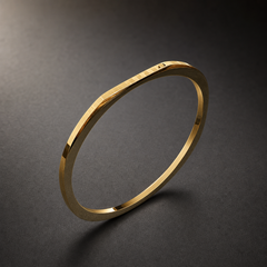 A single rigid square-profile kada in yellow gold colour with a polished mirror finish. The band is about 1/25 of the outer diameter in width and slightly thinner in depth, with a flat square cross-section whose width stays even the whole way round. The closure appears to be a fully closed circle; no hinge, clasp or gap is visible, so there are no terminals. No stones, studs or applied motifs are present.