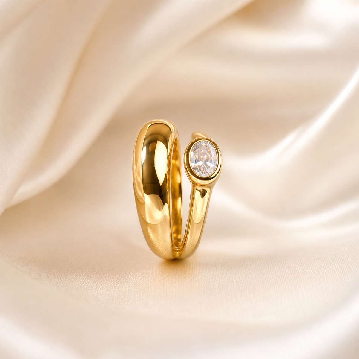 A single ring in yellow-gold-toned metal with a high-polish, mirror-bright finish. The band is a solid, rounded, wide-profile shank of uniform domed cross-section that splits asymmetrically at the crown: one shoulder swells into a broad, smooth, tapering lobe of plain polished metal, while the other shoulder narrows and rises to carry the single stone.