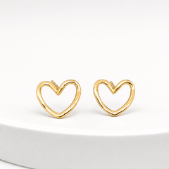 Two ear-worn earrings, a matching-design pair of yellow-gold-tone polished open-heart studs. Each uses a post-and-back stud fitting; short straight posts are partly visible, while the backs are not resolved. Overall drop is minimal, approximately one times the widest heart width. Construction is a single rigid rounded-wire open heart outline with no articulation and no suspended sections.