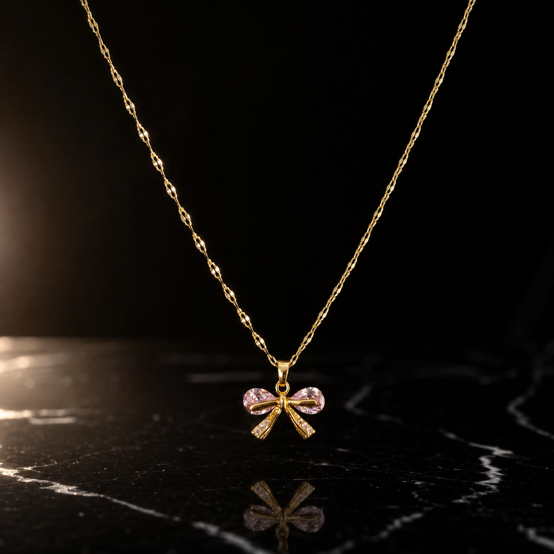 One necklace in yellow-gold-toned metal with a polished finish. It is a single strand of fine, twisted flattened curb-style chain of small uniform link gauge, unbranched, its full run roughly 45 to 50 times the width of the largest component; no extender chain is visible and no working closure is visible within the frame, so clasp type cannot be confirmed.