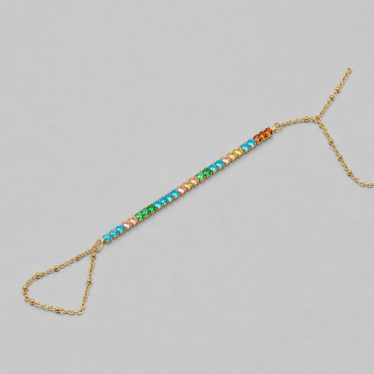 Gold-tone 304 stainless steel hand chain with a row of multicoloured crystals in a line and a ring-and-chain back, laid flat on grey