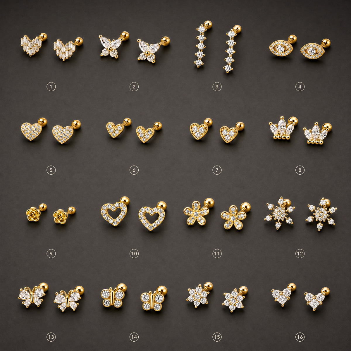 Gold-tone 316L stainless steel stud earrings in a grid of 16 designs, including hearts, butterflies, flowers and snowflakes set with clear stones