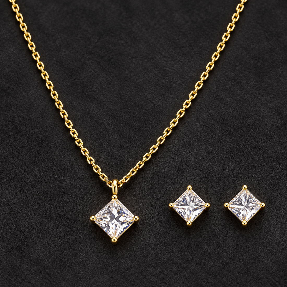 Gold-tone 316L stainless steel necklace and stud earring set with a square cut stone pendant on a fine cable chain