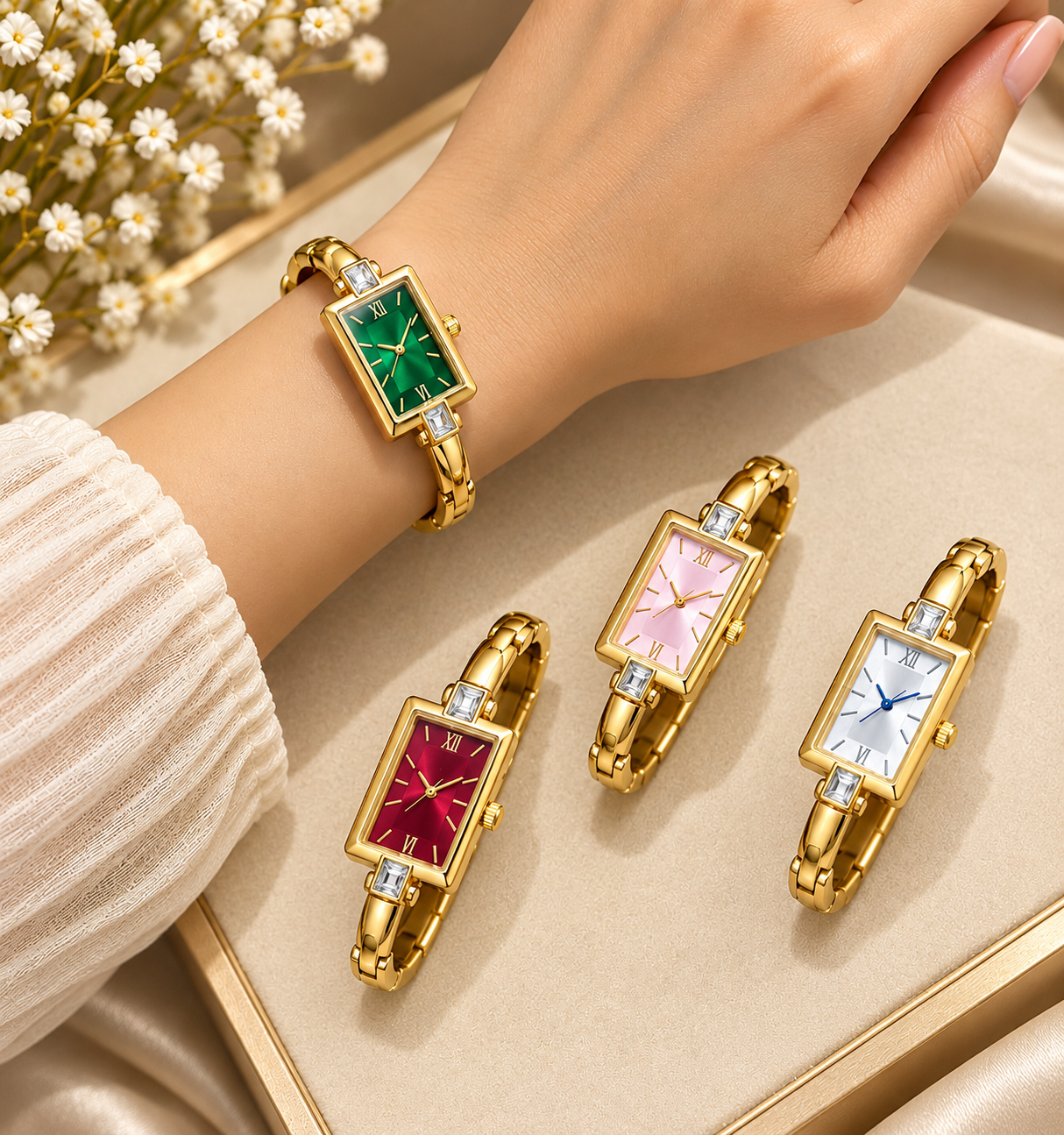 Gold-tone 304 stainless steel bangle-style watch with a rectangular case, crystal-set lugs and Roman numerals, in green, red, pink and white dials